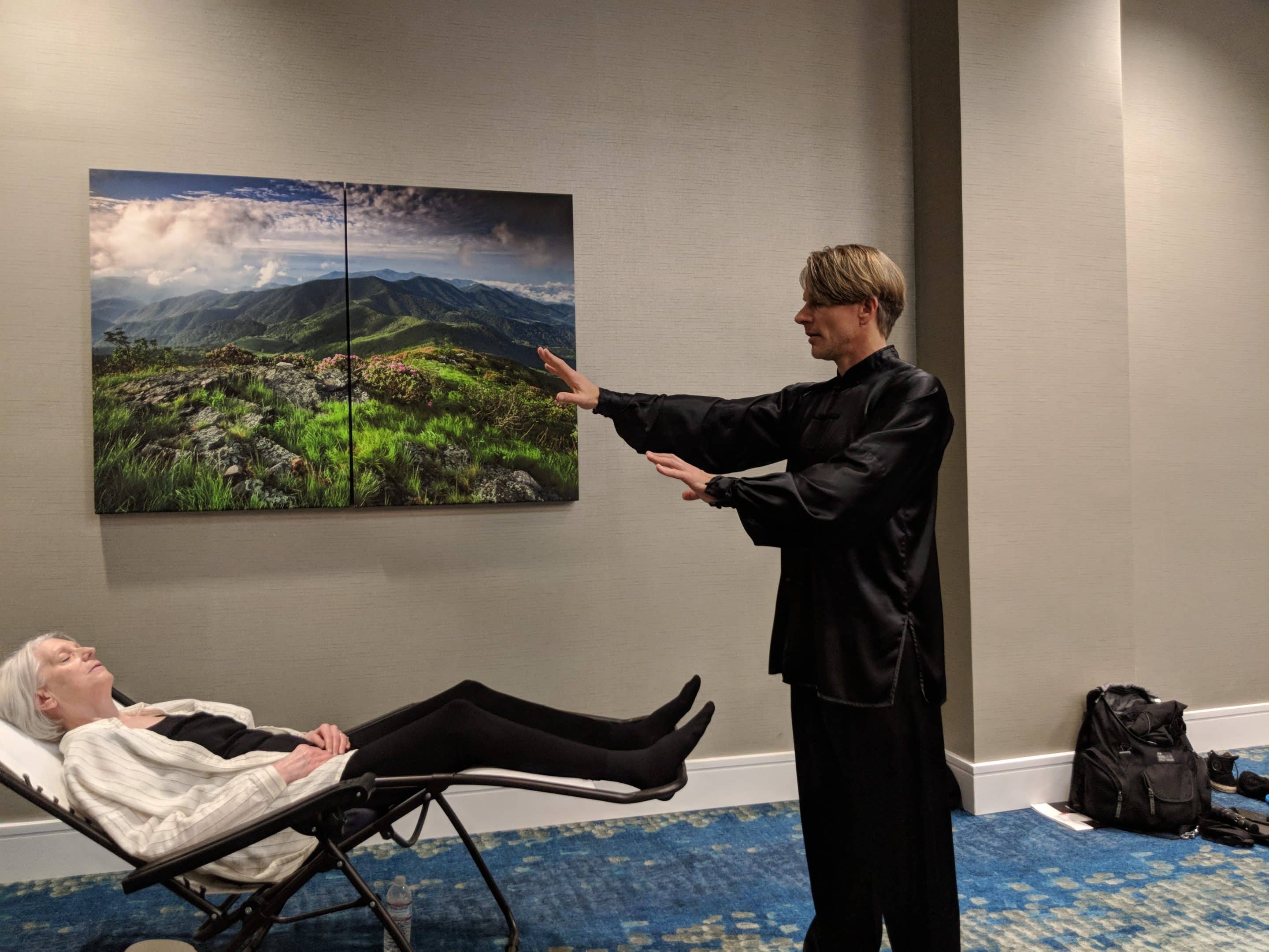 David Coon practicing qigong healing on a senior patient