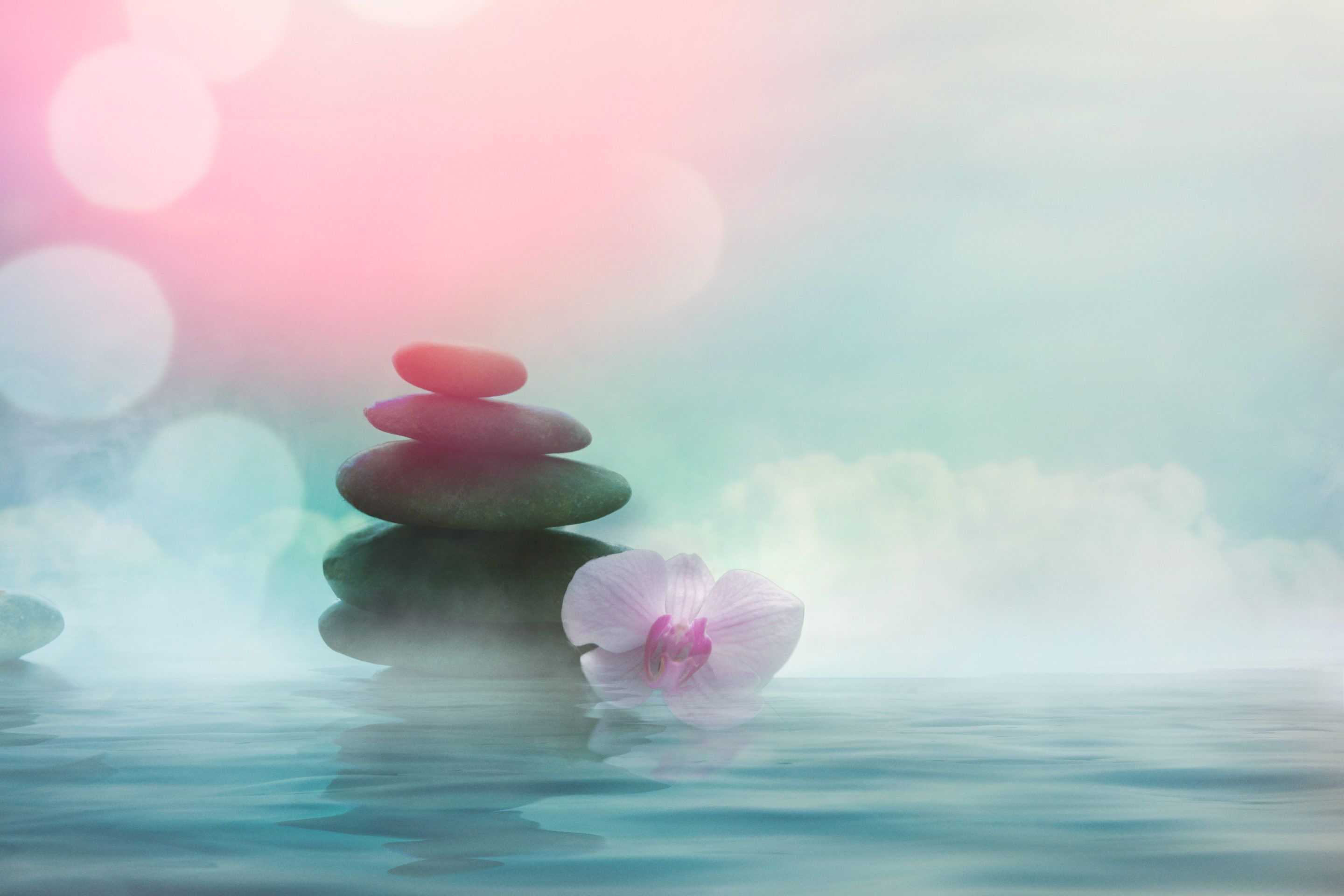 Dreamy landscape with a cairn and clouds